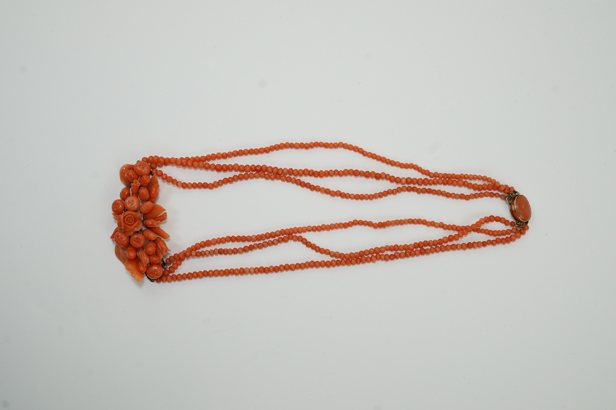 A late Victorian triple strand coral bead necklace